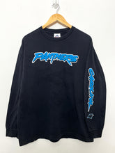 Vintage 1990s Carolina Panthers NFL Football Spell Out Long Sleeve Graphic Tee Shirt (fits adult Large)