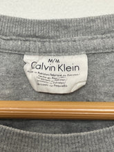 Vintage 1990s Calvin Klein Spell Out Graphic Long Sleeve Tee Shirt (size adult Medium)