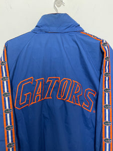 Vintage 1990s Florida Gators Pro Player Spell Out Logo Graphic Lined Zip Up Windbreaker Jacket (size adult XL)