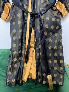 Vintage 1950s/1960s Circular Design Print Tasseled Black and Gold Decorative Elongated Smoking Jacket Robe (size adult Large)