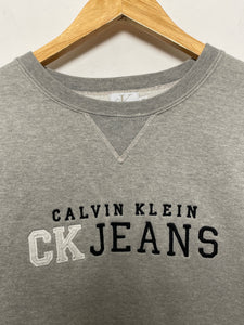 Vintage 1990s Calvin Klein Jeans Spell Out Graphic Crewneck Sweatshirt (size adult Medium)
