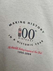 Vintage 2004 Coca Cola 100th Year Anniversary "New Smooth Serve Bottle" Soda Graphic Tee Shirt (cropped adult XL)